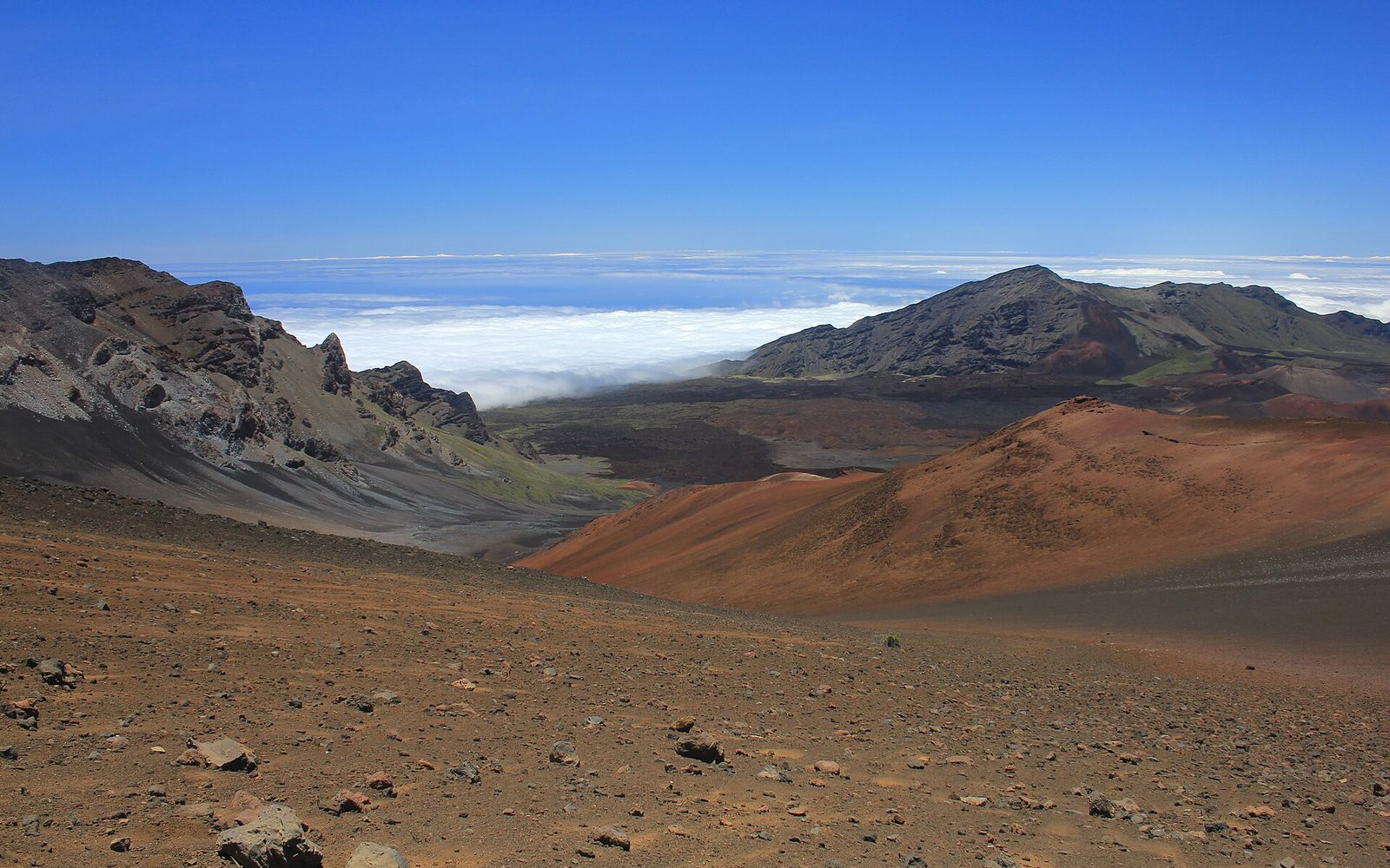Haleakalā crater above the clouds — Maui flight from SFO